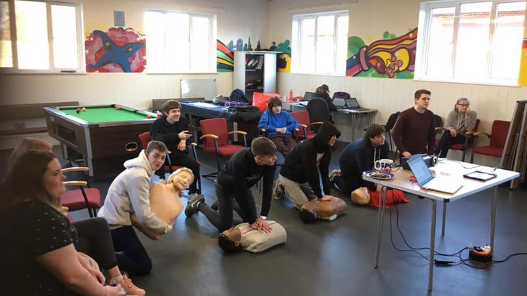 Wealden Works group learning first aid techniques